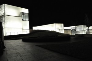A series of “lens” structures are all that can be seen of the Bloch Building from the Nelson’s front lawn. At night, the lenses emit a soft, white glow.