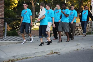 Male students and community members learned what it felt like to walk in high heels. Reactions varied, as some students fumbled a bit. Others were natural pros. 