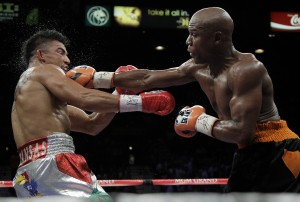 Floyd Mayweather, Jr., delivers the knockout punch that took the WBC welterweight title from Victor Ortiz, a native of Kansas.