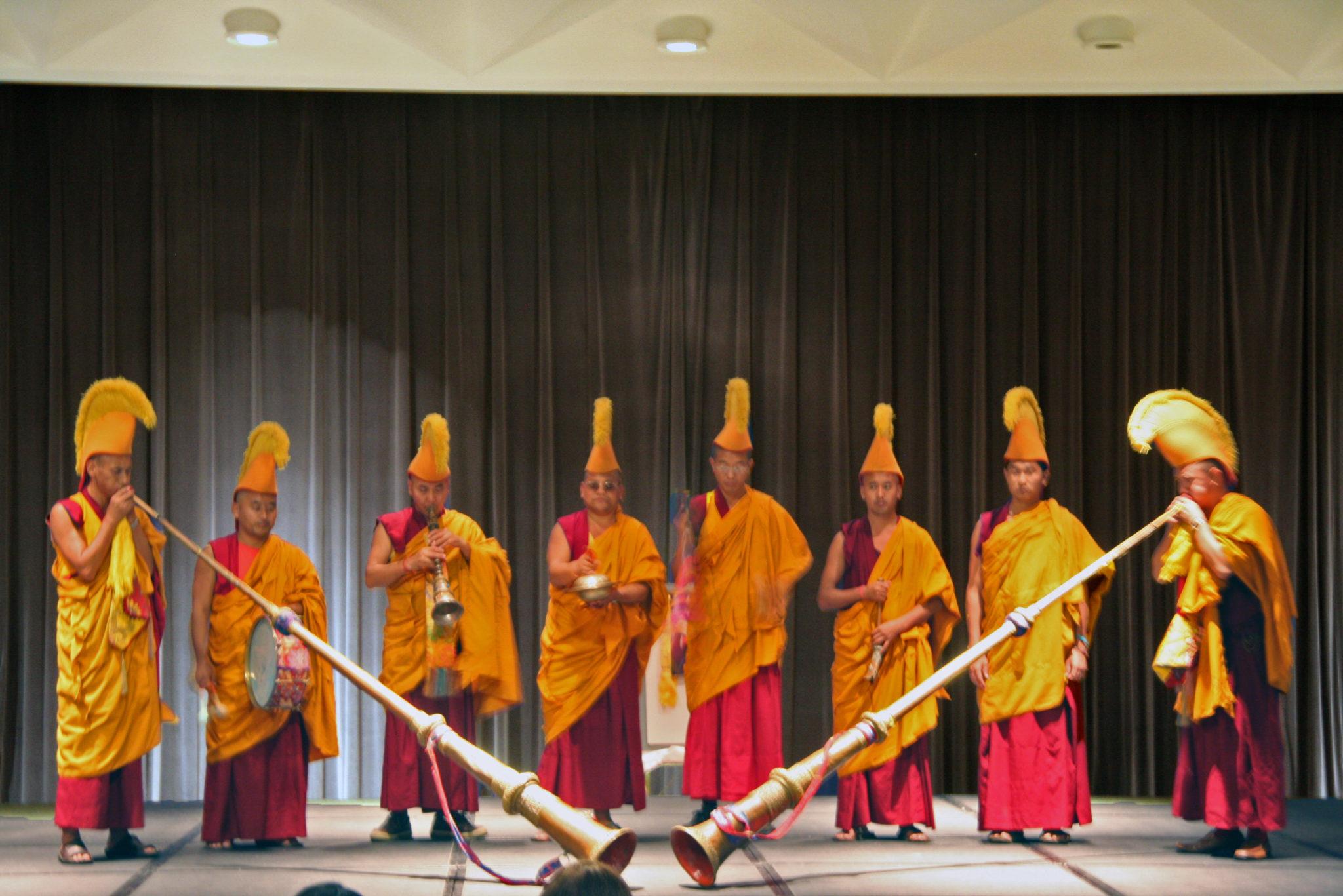 Tibetan monks play traditional long horn instruments at the Tibetan Cultural pageant last Friday at Pierson Auditorium. The horns are used for religious, cermonial and monastic purposes.