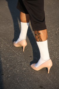 Burly muscular legs in high heels were abundant at UMKC last Thursday. More than 100 men gathered outside the University Playhouse to participate in Walk a Mile in Her Shoes.