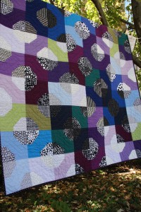 Texture, fabric, and pattern create a beautiful and intricate quilt. 