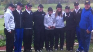 Women’s golf showing off their trophy for the 2nd place finish.