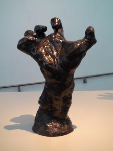 Auguste Rodin’s sculpture “Large Right Clenched Hand” creates a sense of  anguish in the spectator. It suggests the futility of grasping at what is beyond mankind’s reach. The fingers are positioned as if at extreme pain, giving a sense of rigor mortis.  