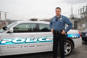 Sergeant Josh Briner of the UMKCPD stands next to his cruiser parked outstide the 4825 Troost Building. Briner is one of five patrol sergeants in the department.