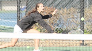 Madeline Schulte makes a return that helped her win her singles and doubles matches.