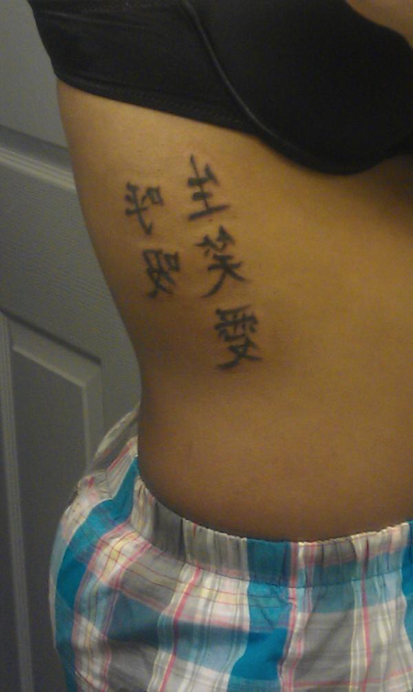 Adams’ Japanese symbols stand for “Breathe” and “Live, Laugh, Love.”