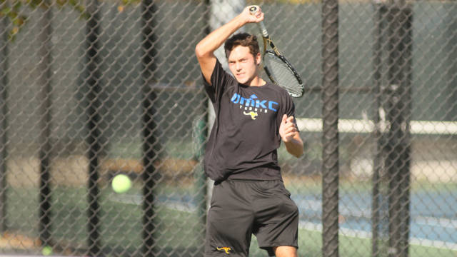 Sophomore Tomas Patino plays a forehand down the line against the Jaguars