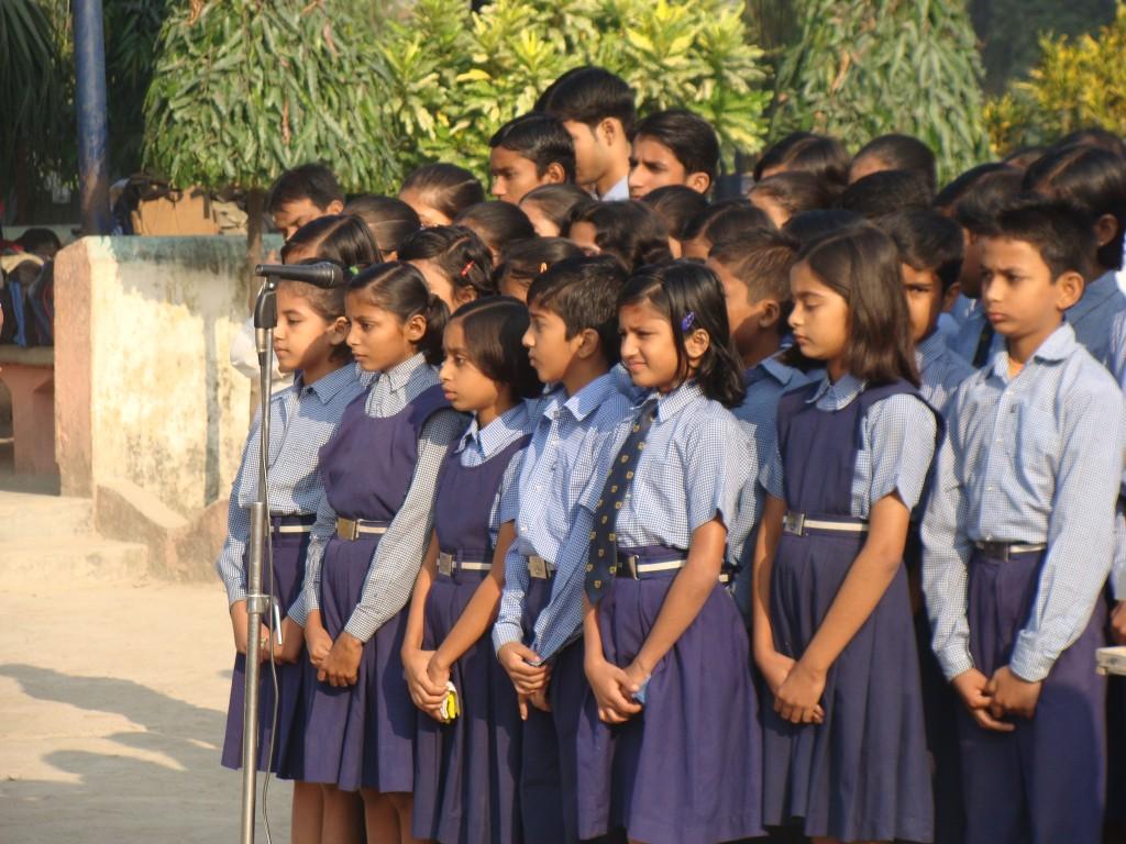 School children in India perform at an outdoor concert. Russ Tuttle’s Project India focuses on providing educational resources to students like these as part of its efforts to combat trafficking.