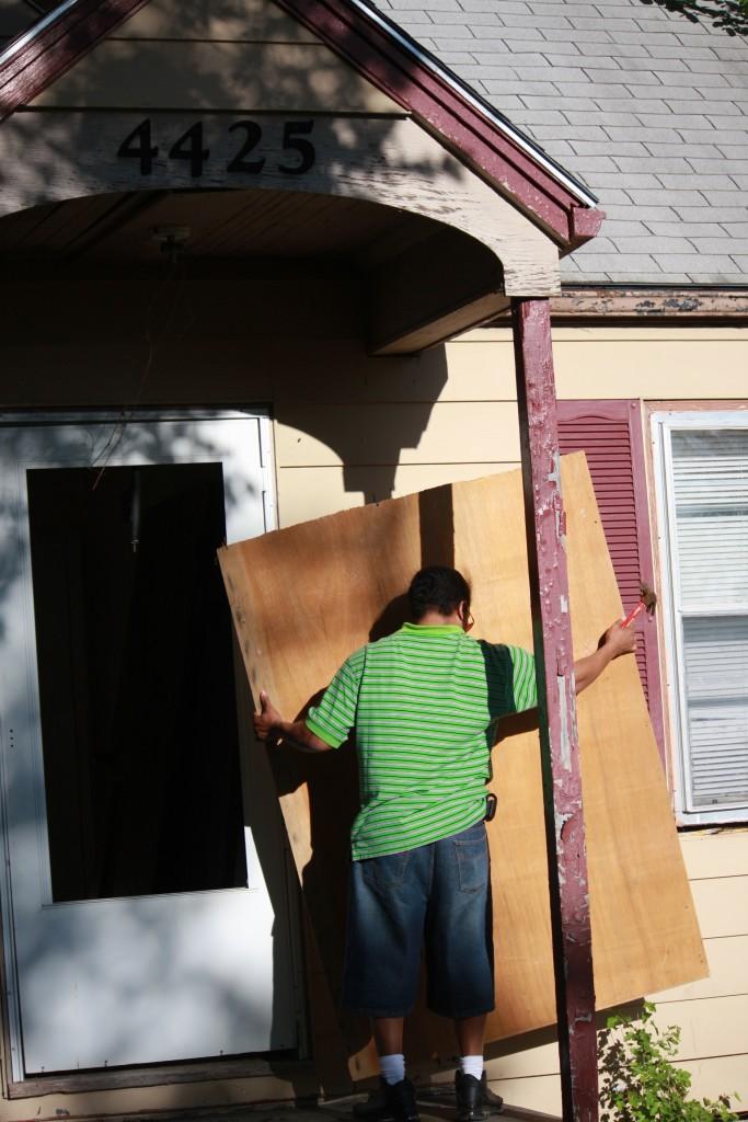 A plywood board protects the entrance to a home Kimble is restoring on Myrtle Avenue from vandals, who are known to steal wiring and other mechanical components of unoccupied homes.