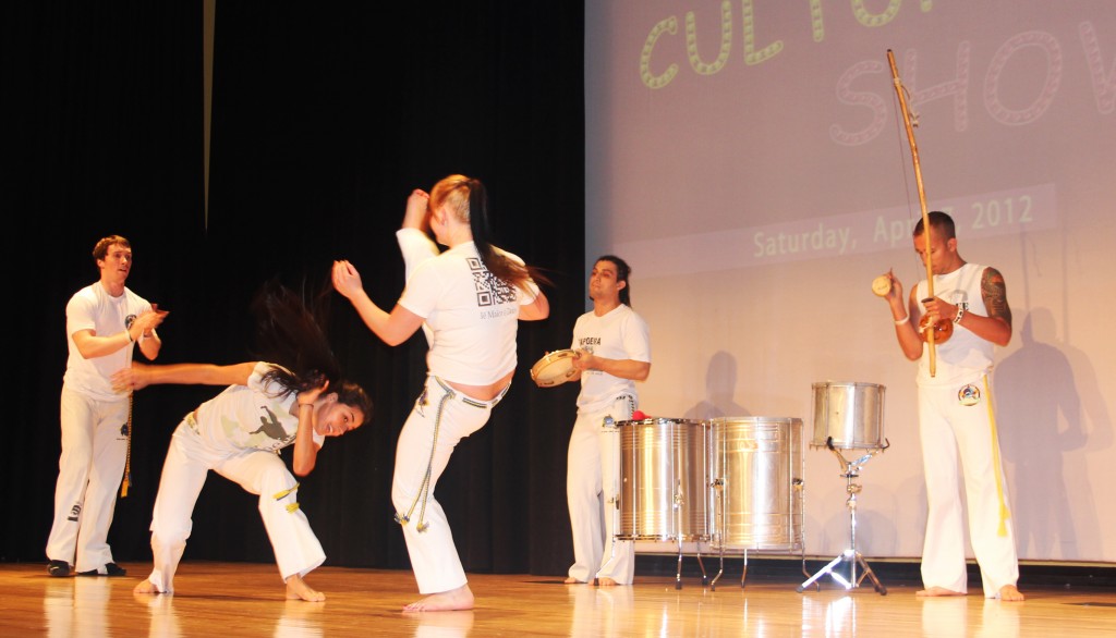Members of Brazilian Academy demonstrate acts of Capoeira.
