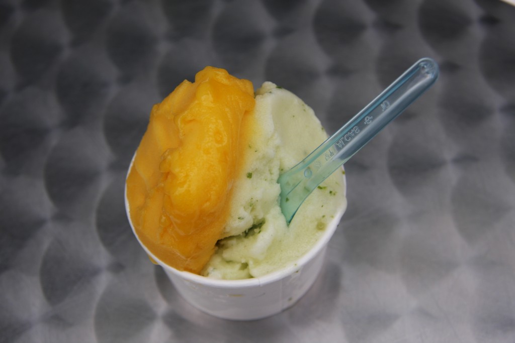 A bowl of the pinapple cilantro and mango-passion fruit sorbet