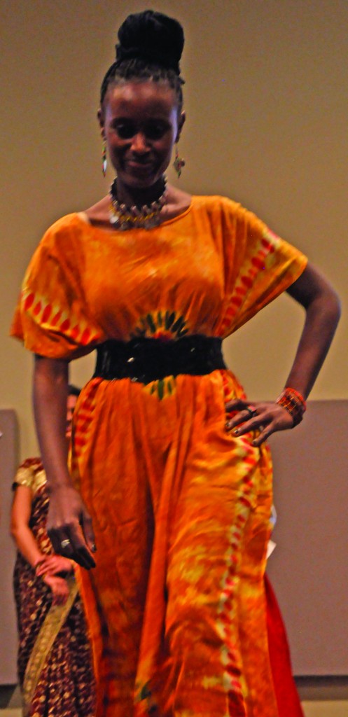 A traditional African dress boasts warm colors and a bold design Photo by Sai Srikar Kadiyam