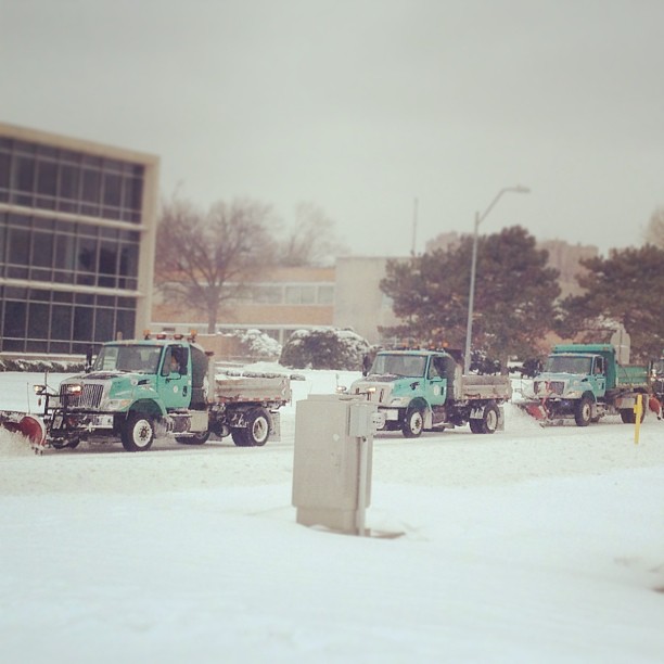 City snow plow trucks work their way across Oak Street on Friday Photo by Caleb-Michael Files 