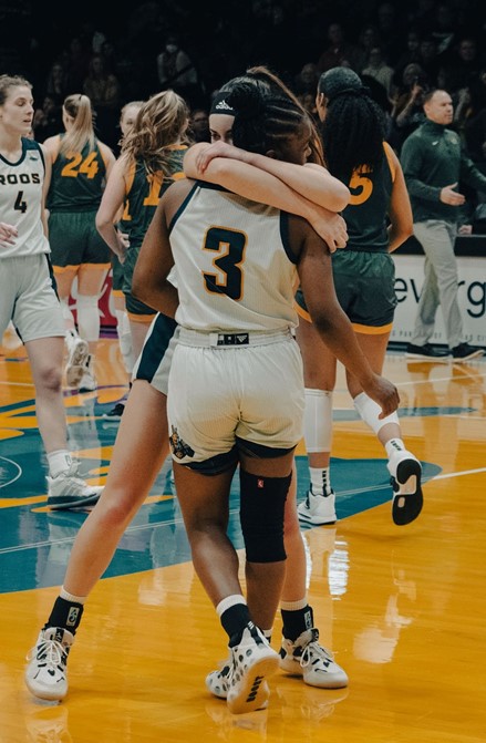 Mandy Willems (#21) hugging Namoie Alnatas (#3) after defeating the Bisons 76-67. (Julia Kapros/Roo News)