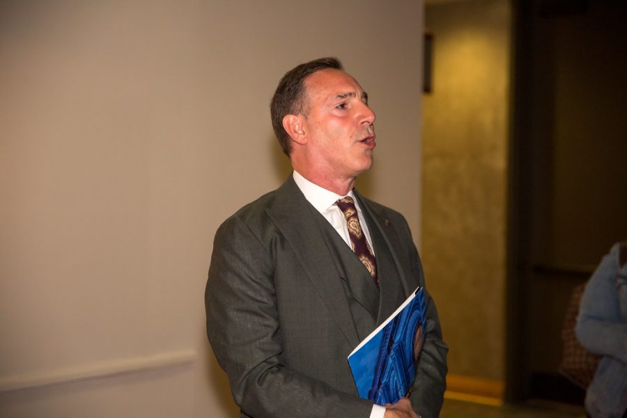 Gaustello speaking to visitors of the Auschwitz exhibit in 2021. 