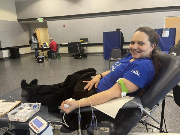 Becky Bergman, an employee at UMKC ASM Roo Advising sits to have her blood drawn.