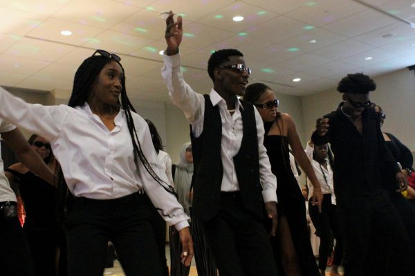 Students dance at the Fake African Wedding event.