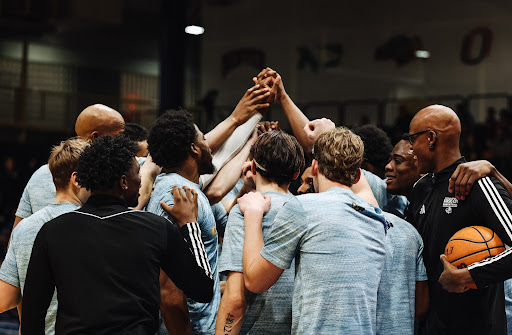 Men’s Basketball huddles before game vs Omaha.