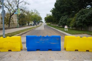 Yellow and blue barricades blocking off 51st Street. 