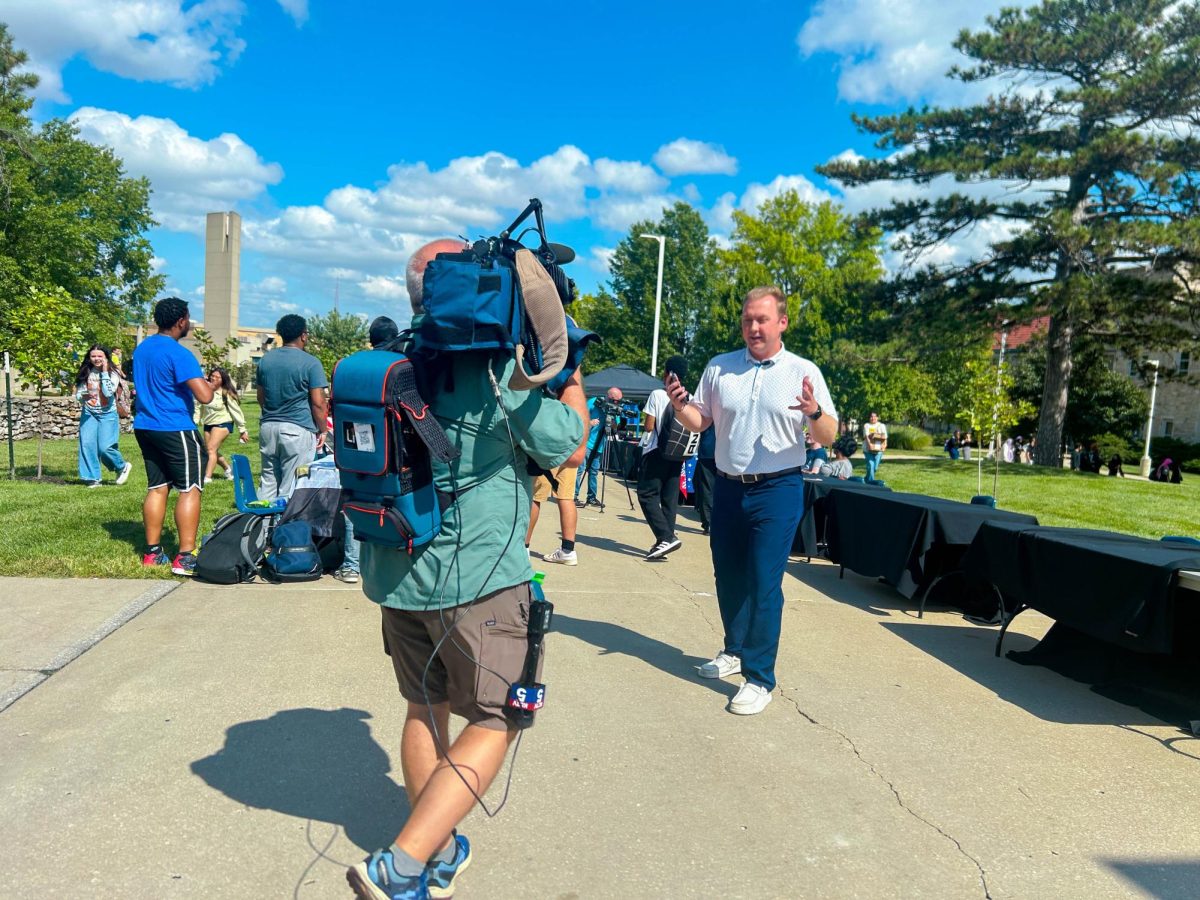 Nathan Brennan and Dwaine Crispell work to film the event. 