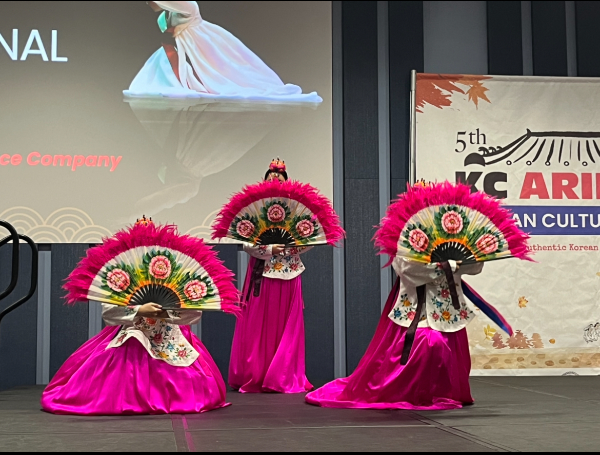 Traditional dancers with their fans.
