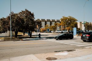 UMKC Student waiting to use crosswalk at 51st and Troost.