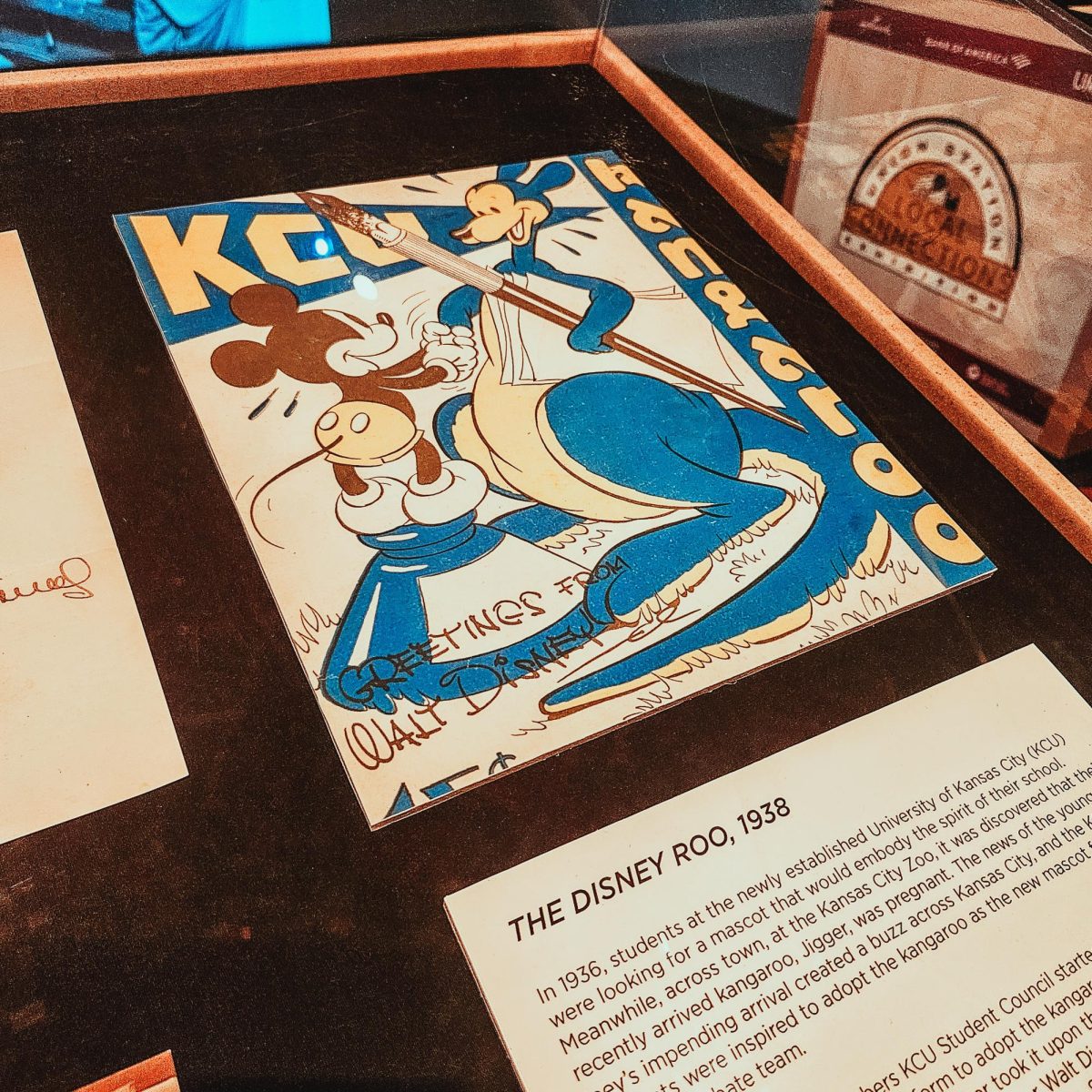  A photo of the original drawing of Kasey the Kangaroo shaking Mickey Mouse’s hand signed by Walt Disney.