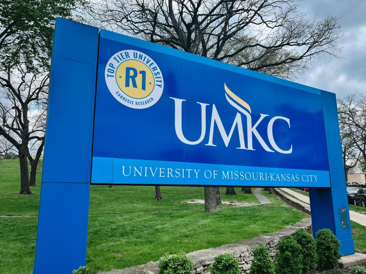 The main UMKC campus sign welcomes visitors featuring the newly earned Carnegie Research R1 designation. Shortly after, UMKC was named to the U.S. News Top 100 list. Pictured April 17, 2025. 