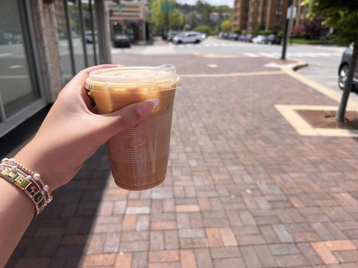 A latte featuring the Messenger Coffee logo on the cup.