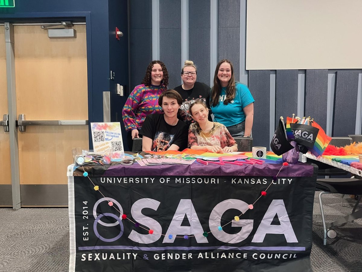 Members of SAGA behind their booth at the event.
