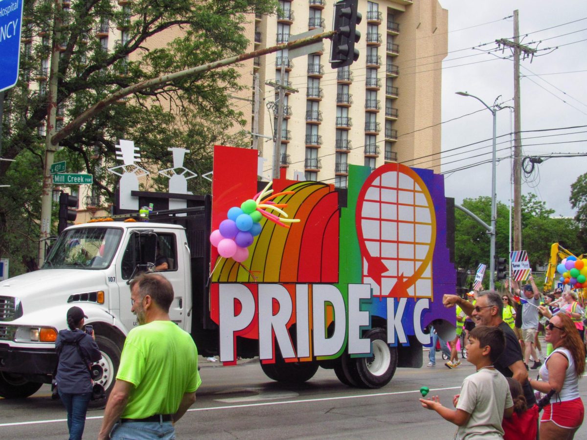 Watchers cheer on as Pride KC truck passes.