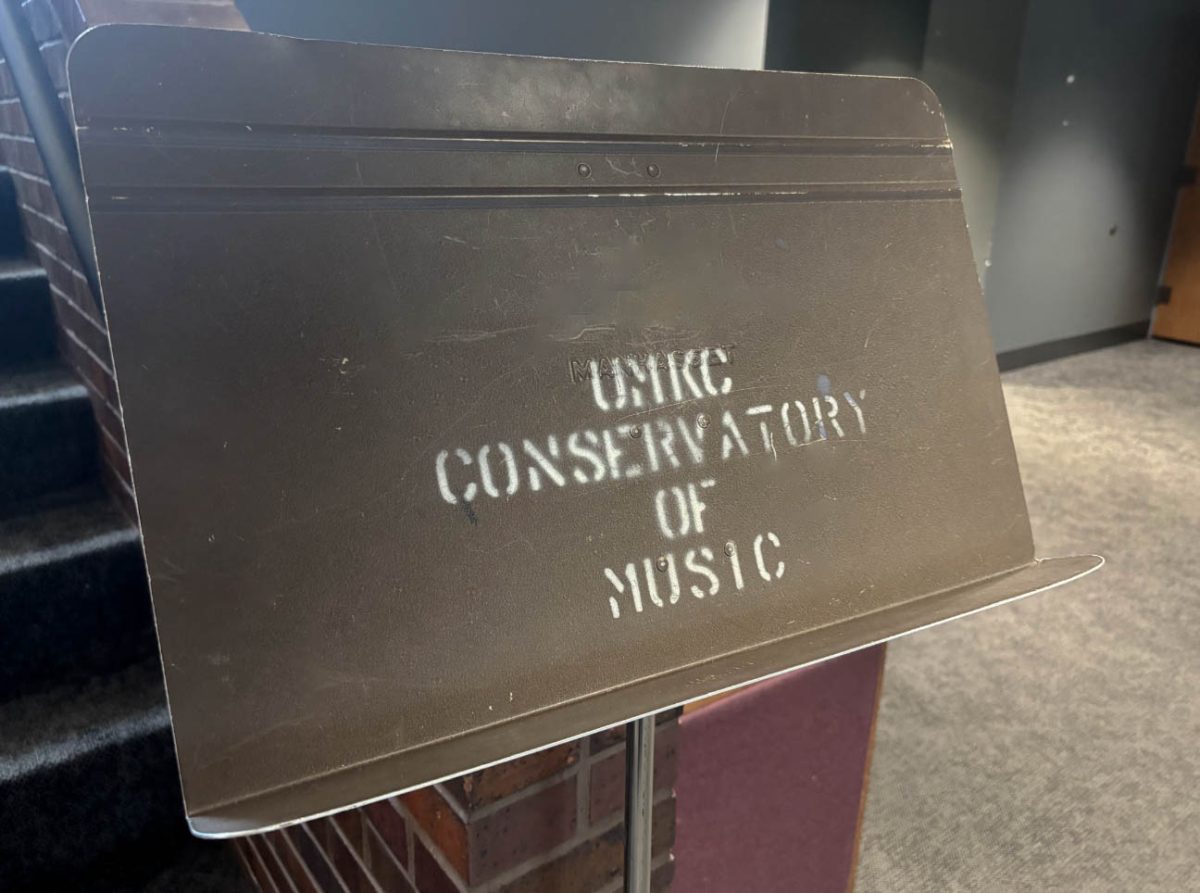 UMKC Conservatory labeled on a music stand. 