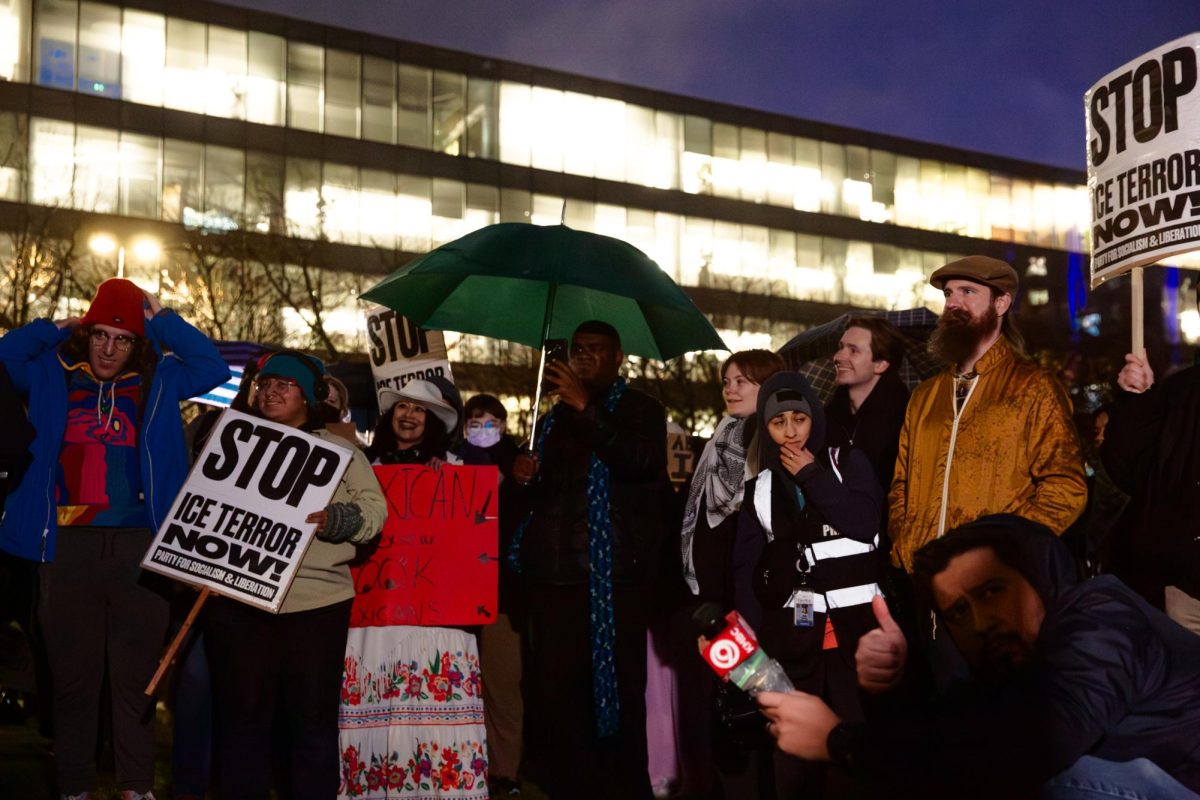Attendees at an anti-ICE rally on Jan. 8 at City Hall crowded around the Party for Socialism and Liberation (PSL) speakers, holding signs with Renee Good’s photo saying “Justice for Renee Nicole Good.”