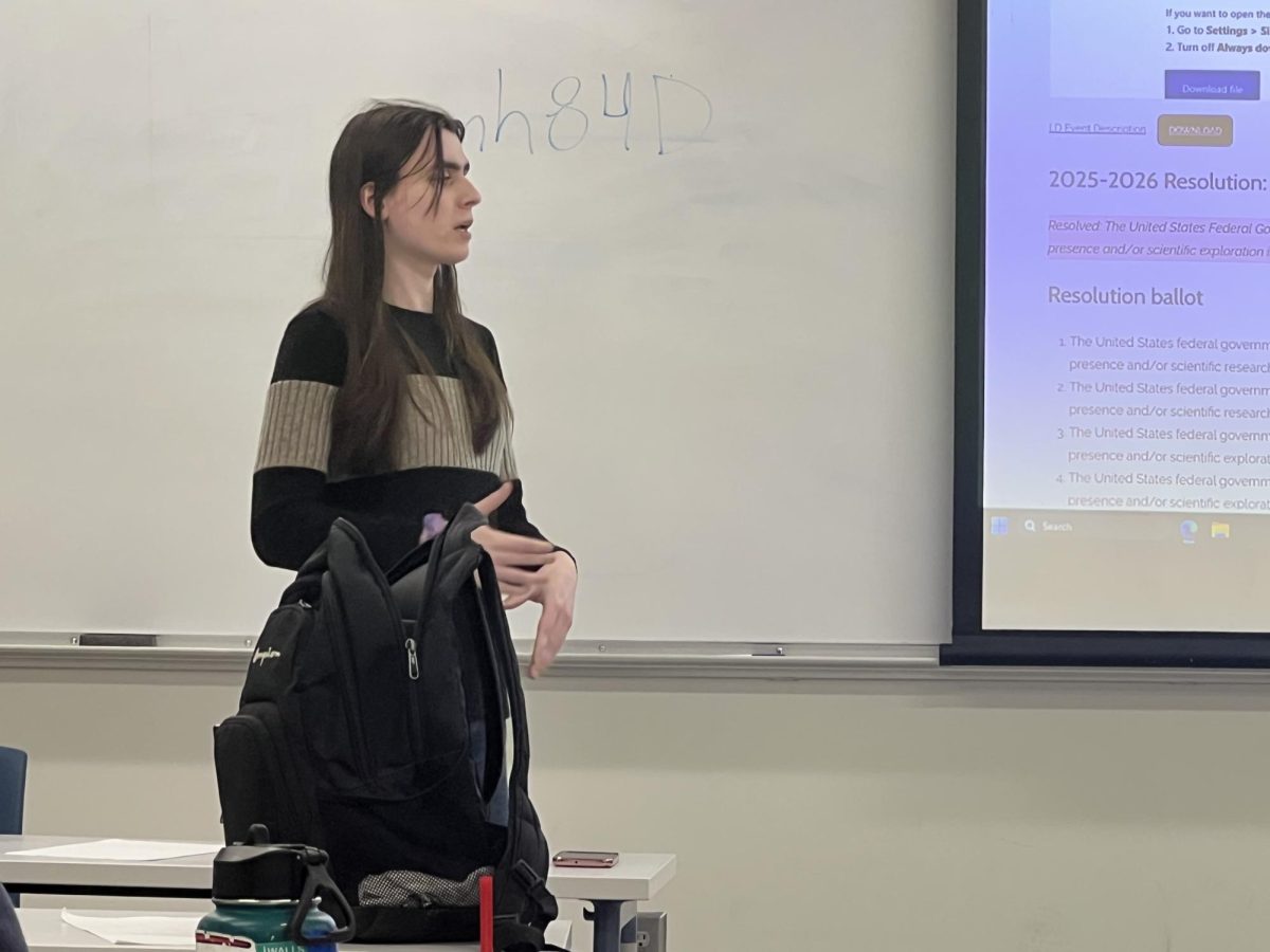 Ariana Holmberg at practice, debating the environmental impact on penguin populations