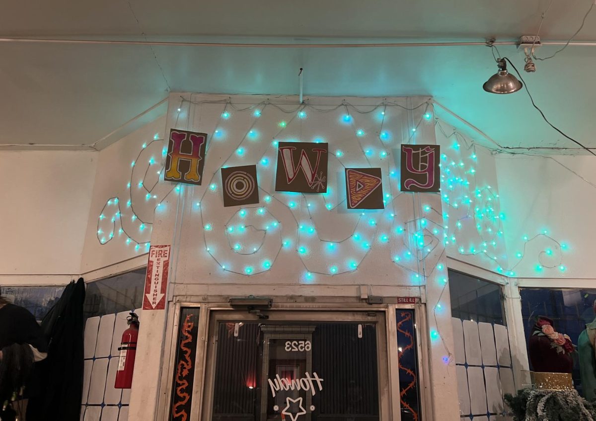 Howdy sign lit with string lights