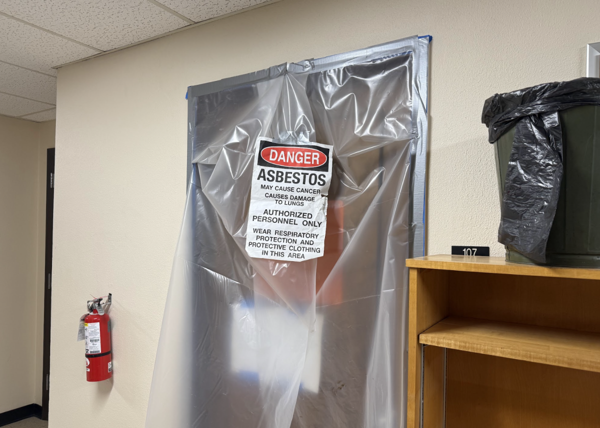 Asbestos sign and work zone in the Fine Arts Building.