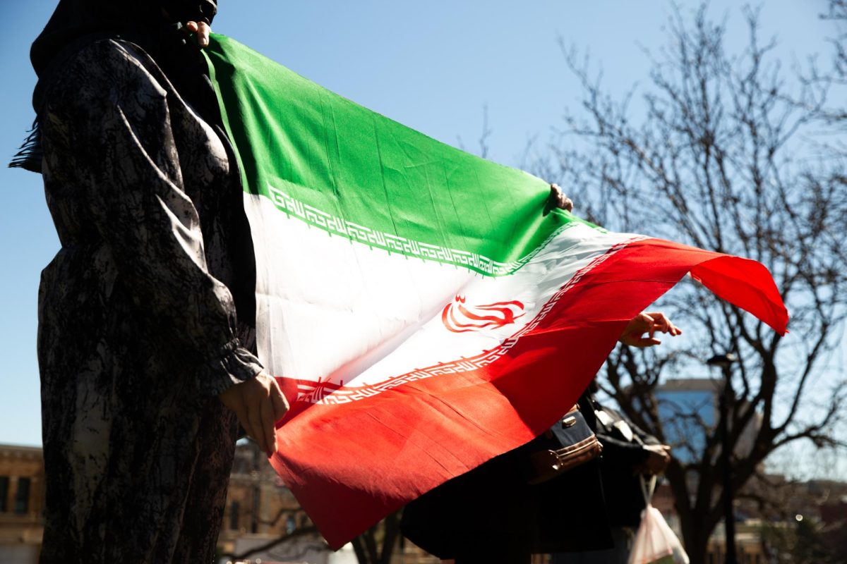Over 100 people gathered on March 8 to protest against the U.S.-Israel military operations against Iran. The protest included a 10-minute march around the City Market. 