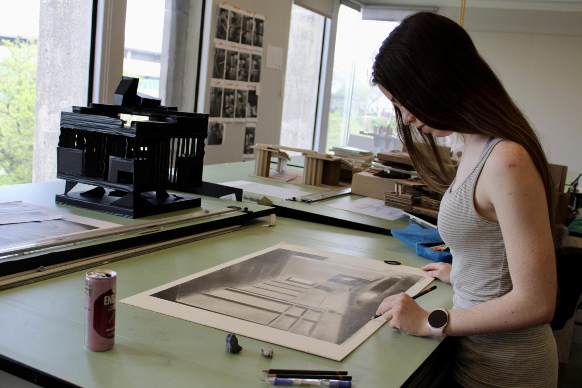 Sophia Dunahee, a first-year architecture student, working on a project during her studio class.